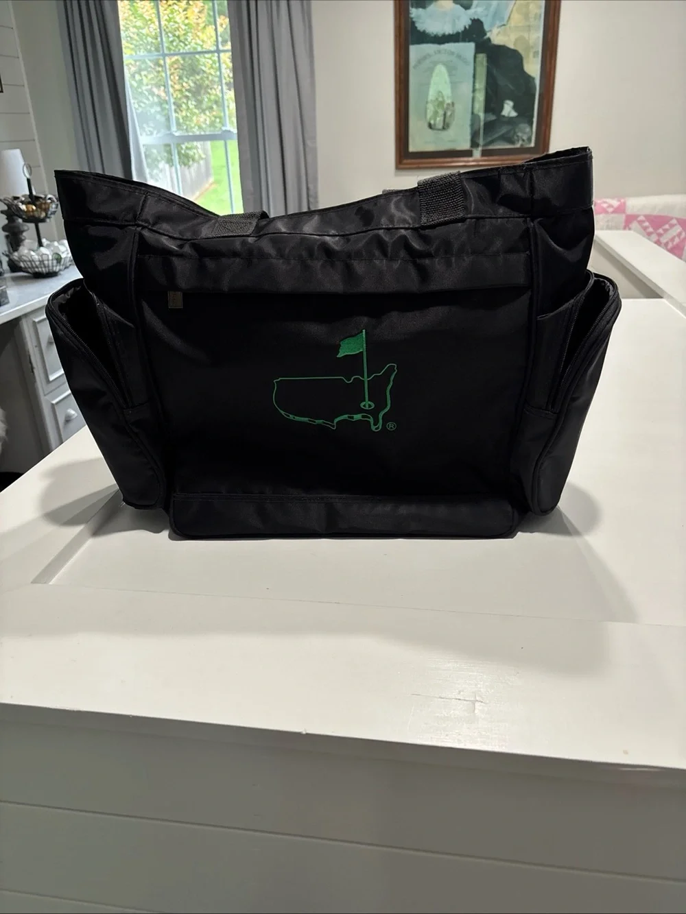 The Master’s officially licensed Black Tote Bag with Green Golf Flag Logo